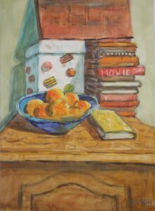 a still life of a pile of books and fruit on a cupboard