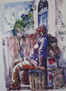 man sitting outside in morocco