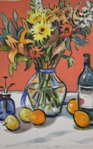 A vase of colourful flowers painted in oranges and yellows with a blue ribbon